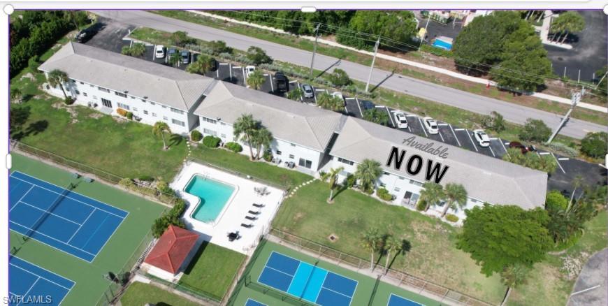 3250 10th Street North, Unit A6 Naples, FL 34103 - Photo 2 of 12 an aerial view of houses with yard