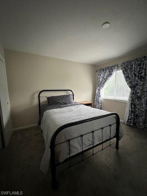 3250 10th Street North, Unit A6 Naples, FL 34103 - Photo 9 of 12 a bedroom with a bed and window