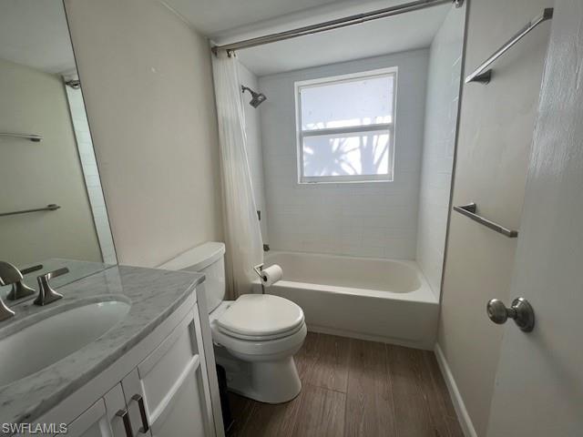 3250 10th Street North, Unit A6 Naples, FL 34103 - Photo 10 of 12 a bathroom with a sink toilet and shower