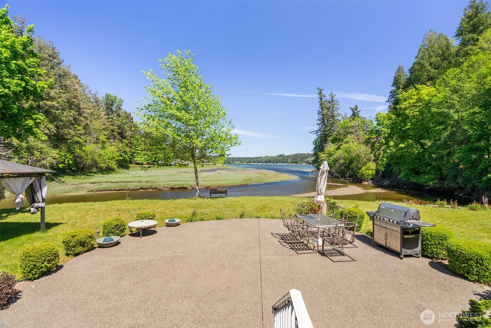 8320 East Grapeview Loop Road Allyn, WA 98524 - Photo 32 of 38 a view of a swimming pool and a yard