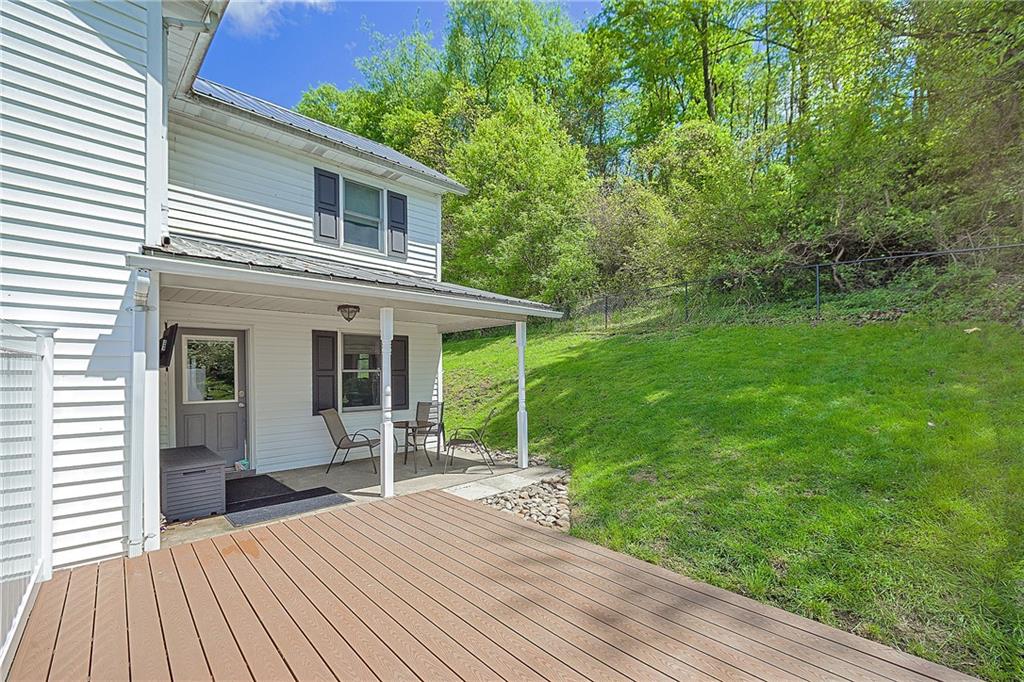 86 Mountain Road Uniontown, PA 15401 - Photo 17 of 27 a view of a house with backyard and sitting area
