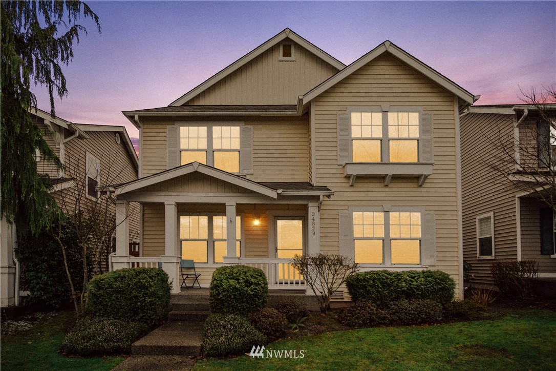 34829 Southeast Ridge Street Snoqualmie, WA 98065 - Photo 1 of 19 a front view of a house with a yard