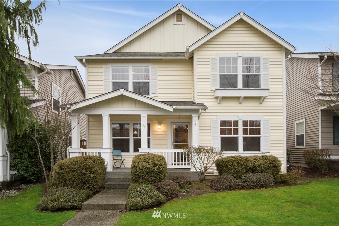 34829 Southeast Ridge Street Snoqualmie, WA 98065 - Photo 18 of 19 a front view of a house with a yard