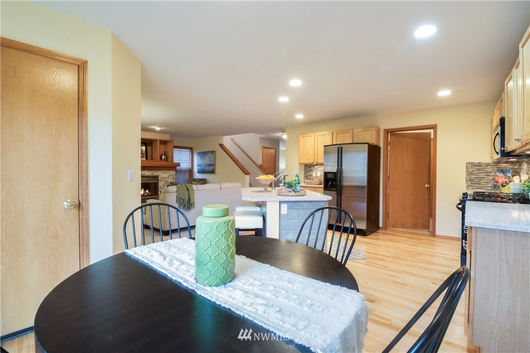 34829 Southeast Ridge Street Snoqualmie, WA 98065 - Photo 6 of 19 a view of a dining room with furniture a rug and wooden floor