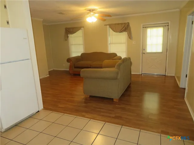 a living room with furniture and a rug