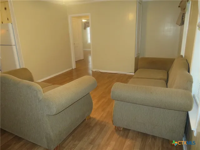 a living room with a couch and a rug