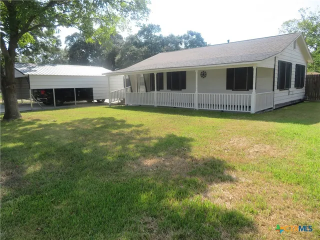 a front view of a house with swimming pool