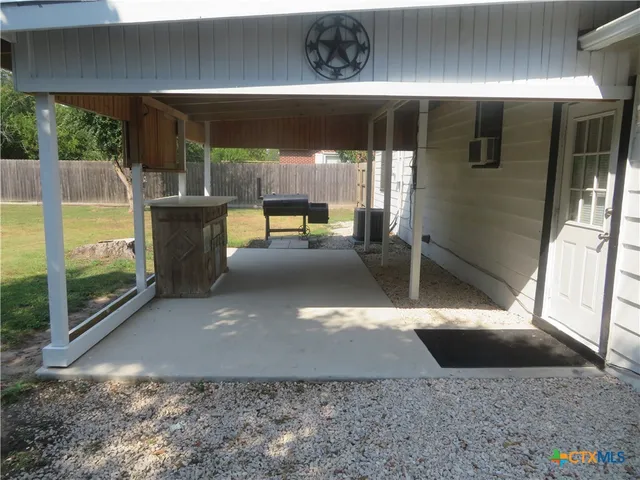 a view of a porch with furniture