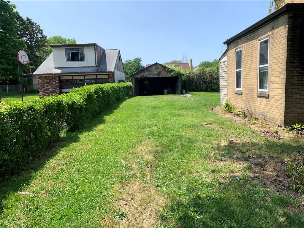 747 Frederick Street McKees Rocks, PA 15136 - Photo 23 of 25 a front view of a house with a yard