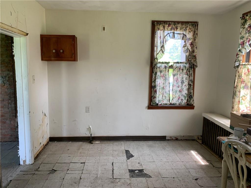 747 Frederick Street McKees Rocks, PA 15136 - Photo 3 of 25 an empty room with windows and closet