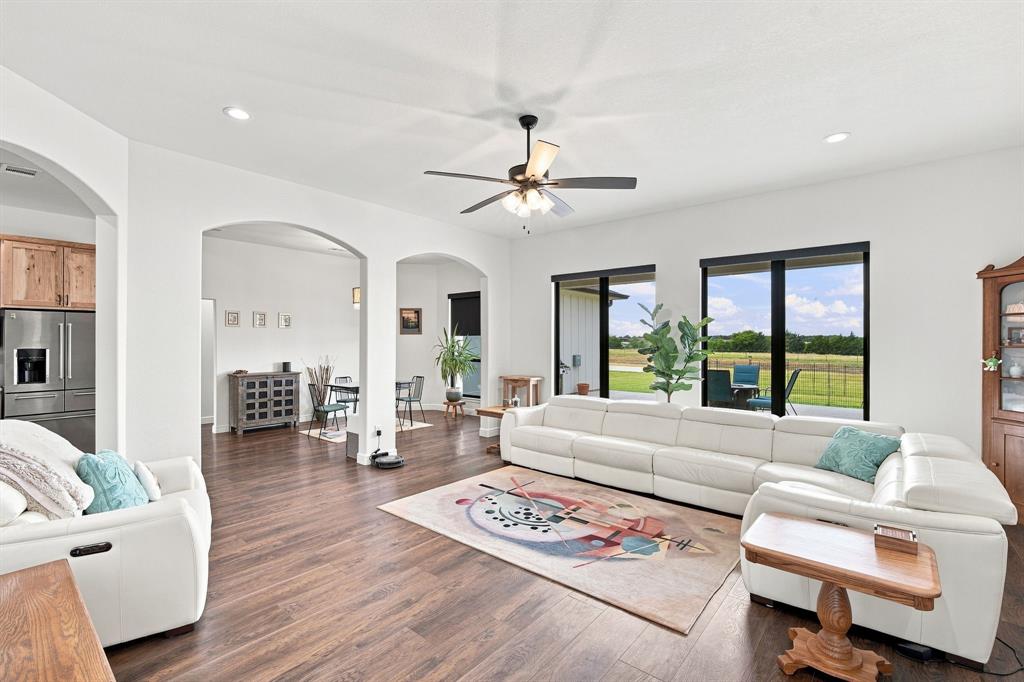 140 Lone Elm Road Midlothian, TX 76065 - Photo 7 of 36 Spacious living room designed for comfortable everyday living and entertaining.