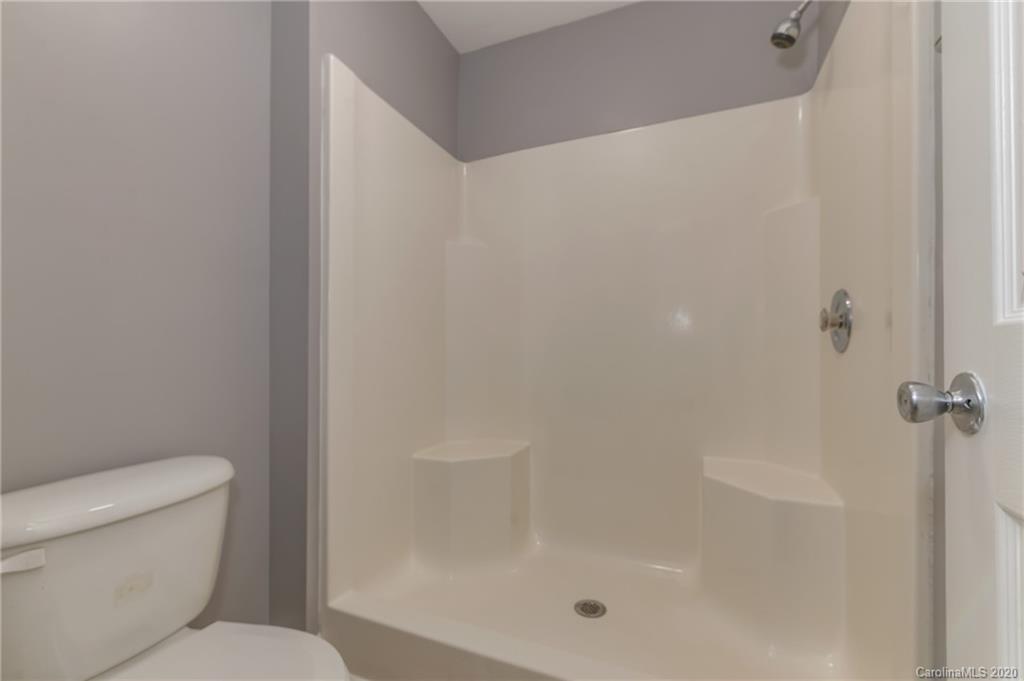 136 Carolina Paradise Road Rutherfordton, NC 28139 - Photo 14 of 30 a white toilet sitting next to a bath tub