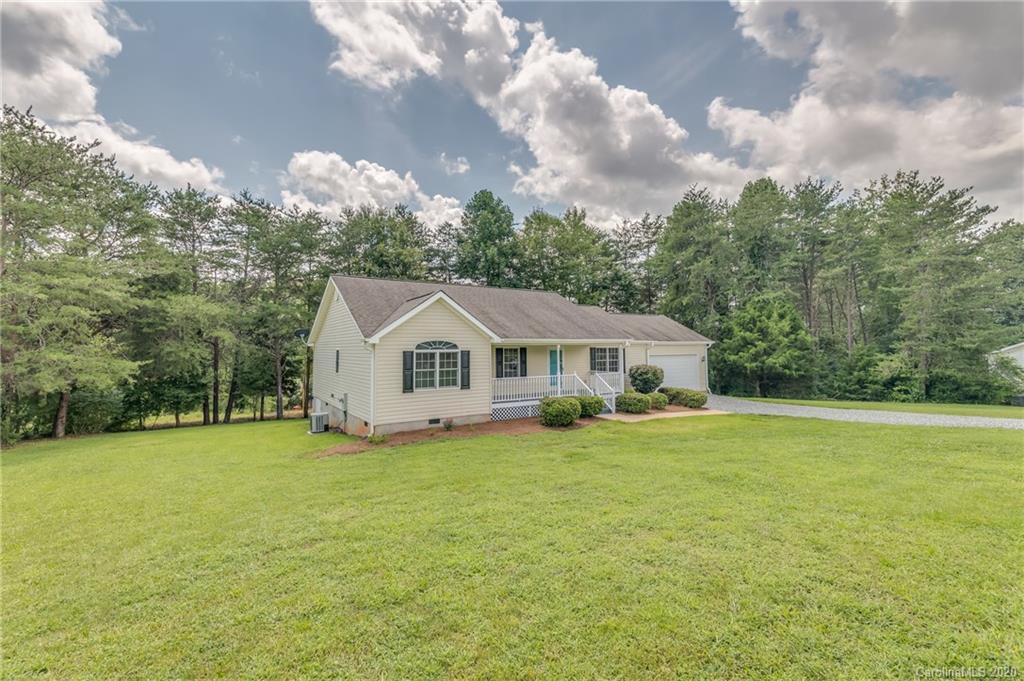 136 Carolina Paradise Road Rutherfordton, NC 28139 - Photo 22 of 30 a big house with a big yard and large trees