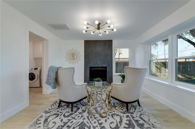 a view of a livingroom with furniture a fireplace