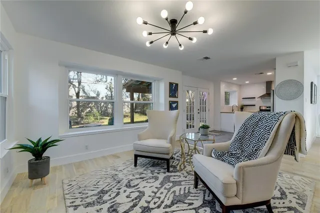 a living room with furniture and a large window