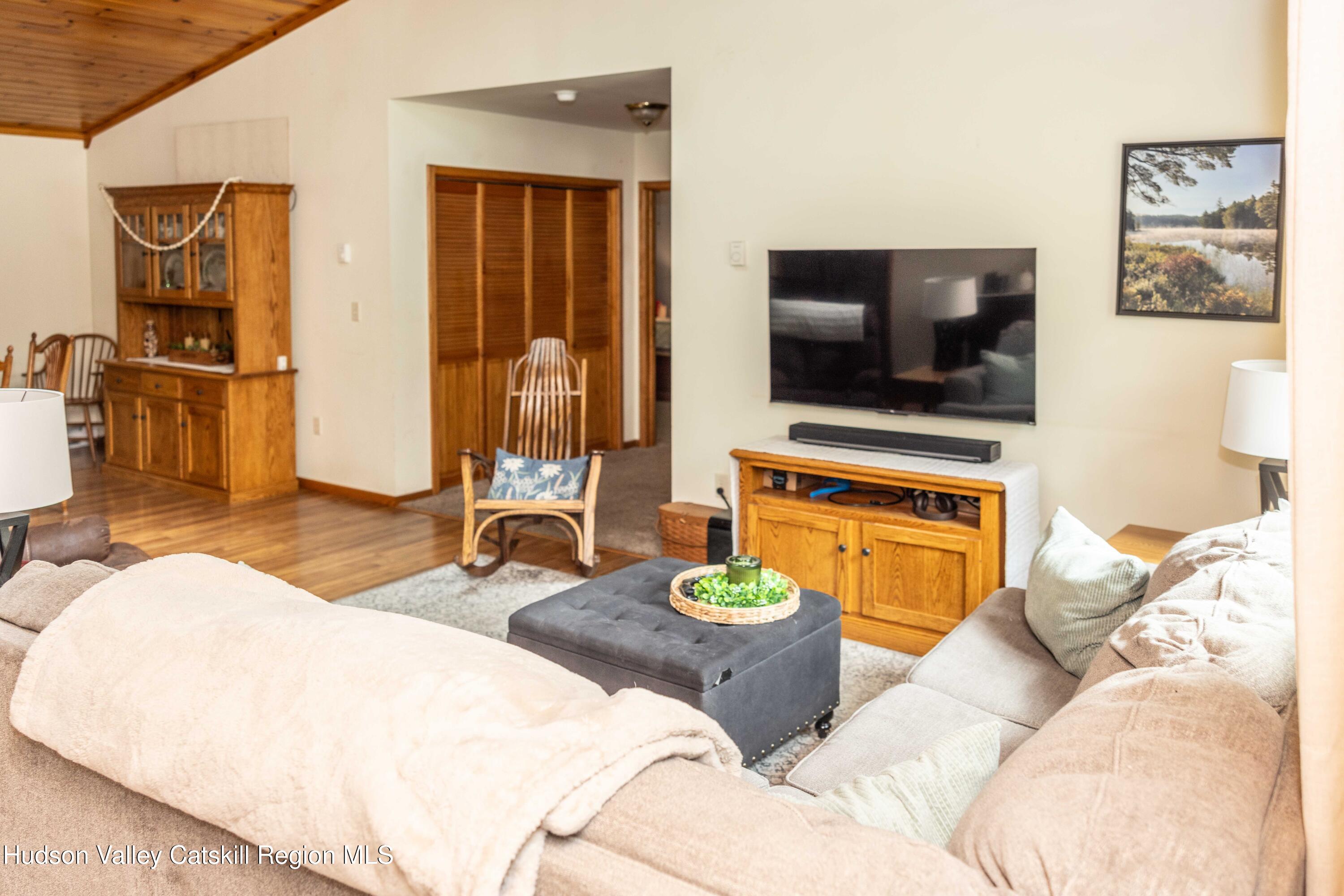 736 Plattekill Road Freehold, NY 12431 - Photo 14 of 47 a living room with furniture and a flat screen tv