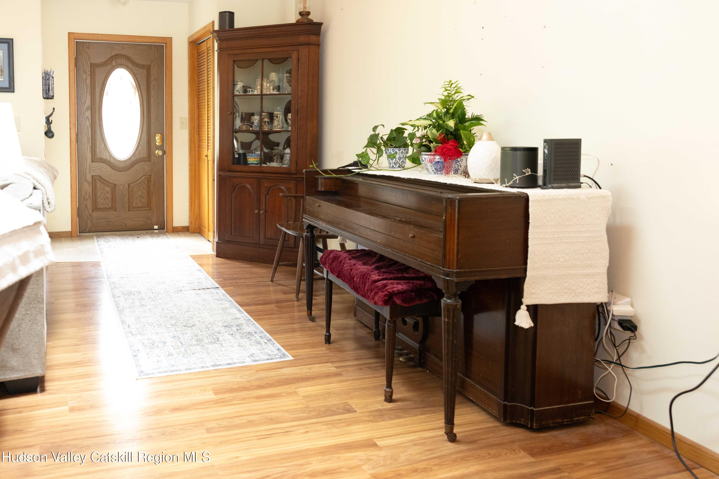 736 Plattekill Road Freehold, NY 12431 - Photo 21 of 47 a living room with furniture and wooden floor