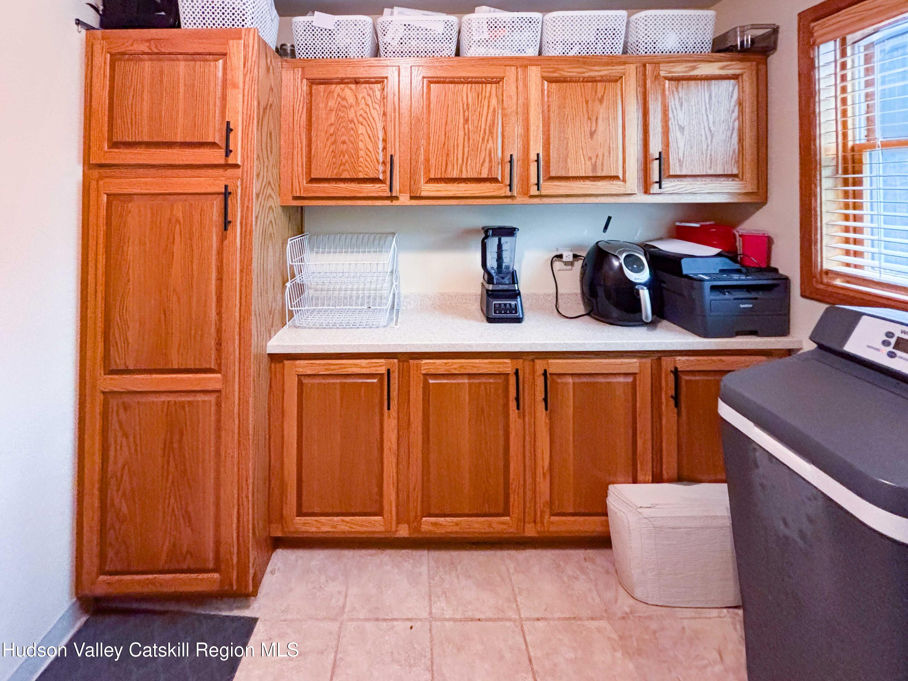 736 Plattekill Road Freehold, NY 12431 - Photo 26 of 47 a kitchen with stainless steel appliances granite countertop a refrigerator and cabinets