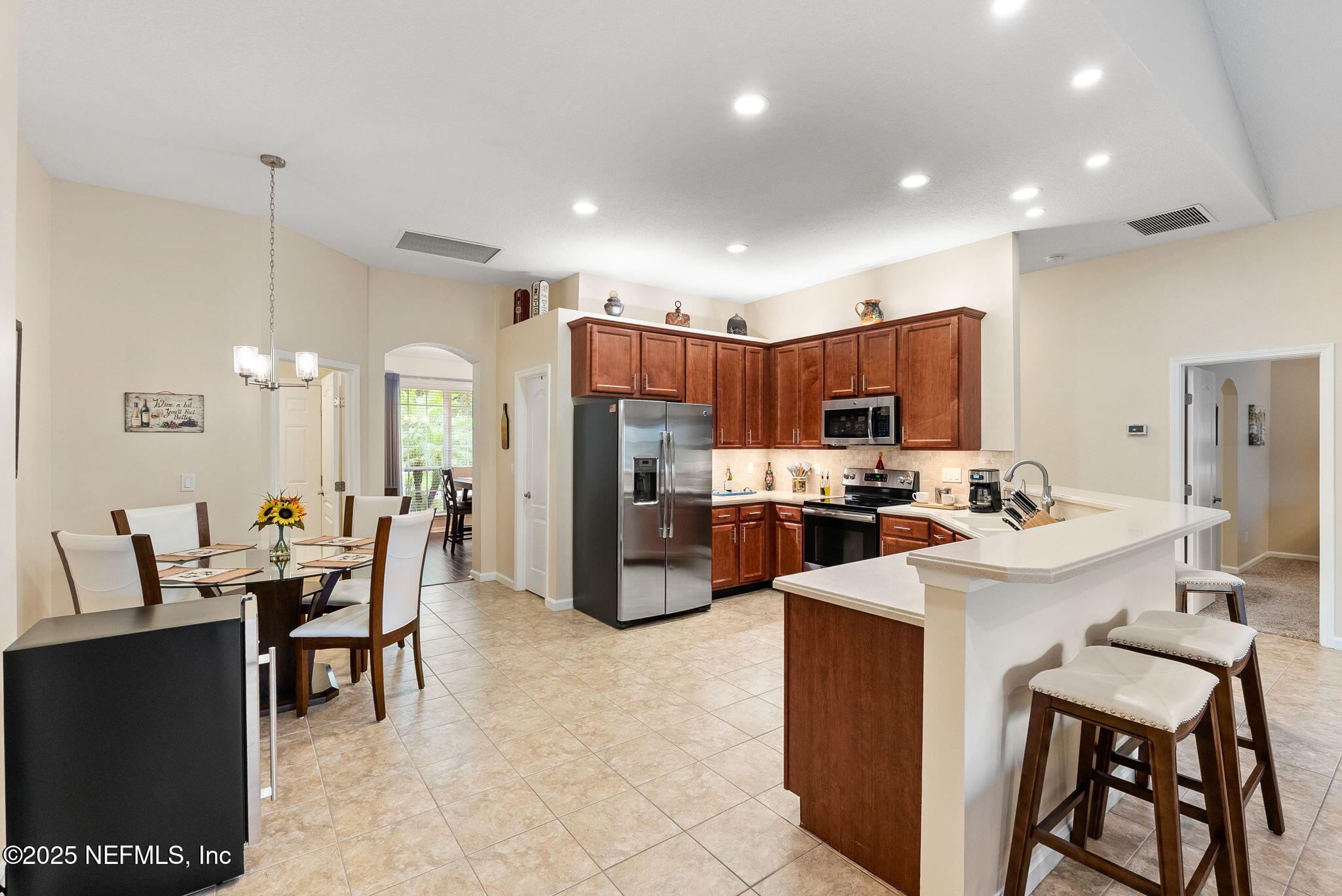 1428 Riva Del Garda Way St. Augustine, FL 32092 - Photo 11 of 44 a kitchen with a sink a counter top stainless steel appliances and cabinets