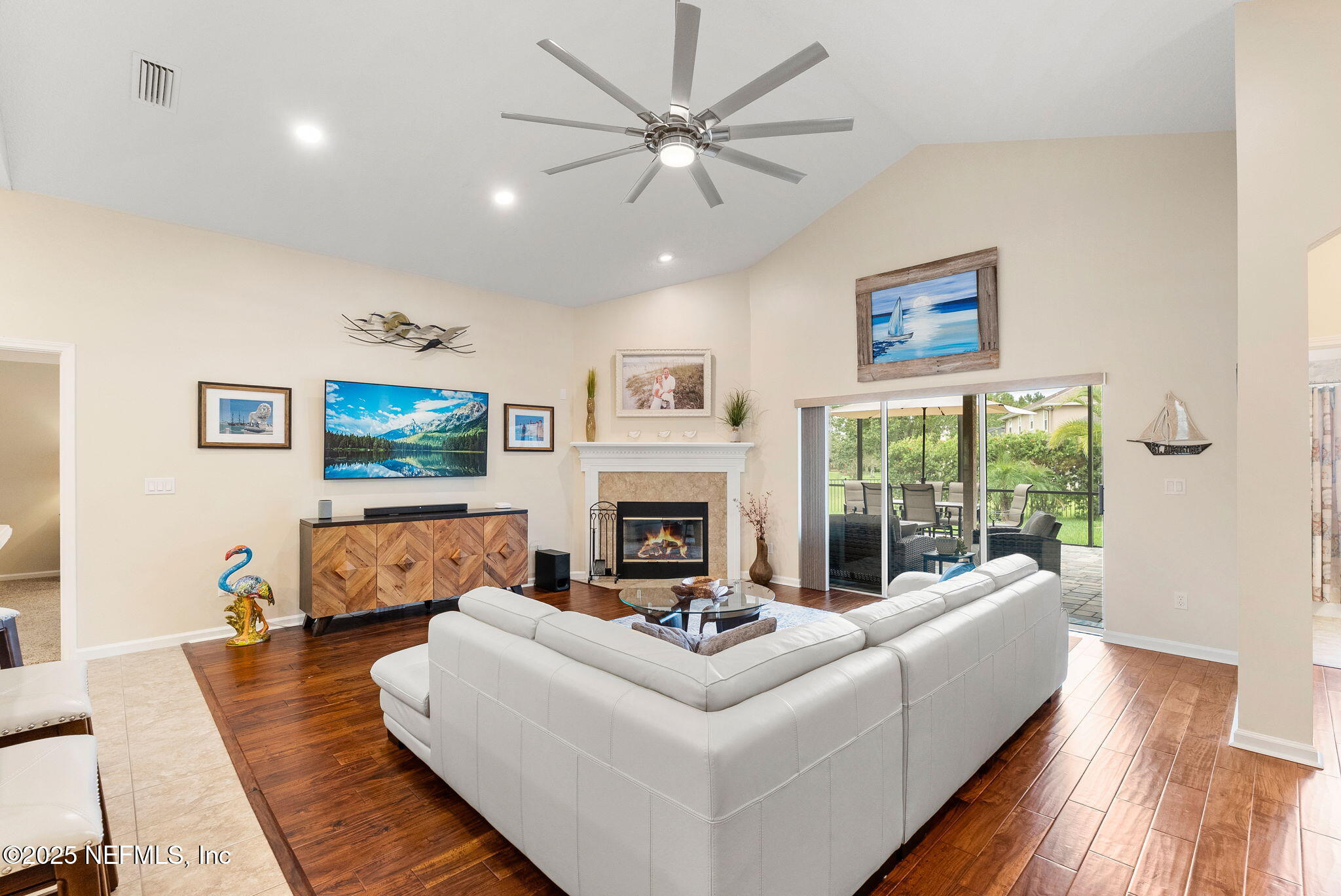 1428 Riva Del Garda Way St. Augustine, FL 32092 - Photo 15 of 44 a living room with furniture and a fireplace