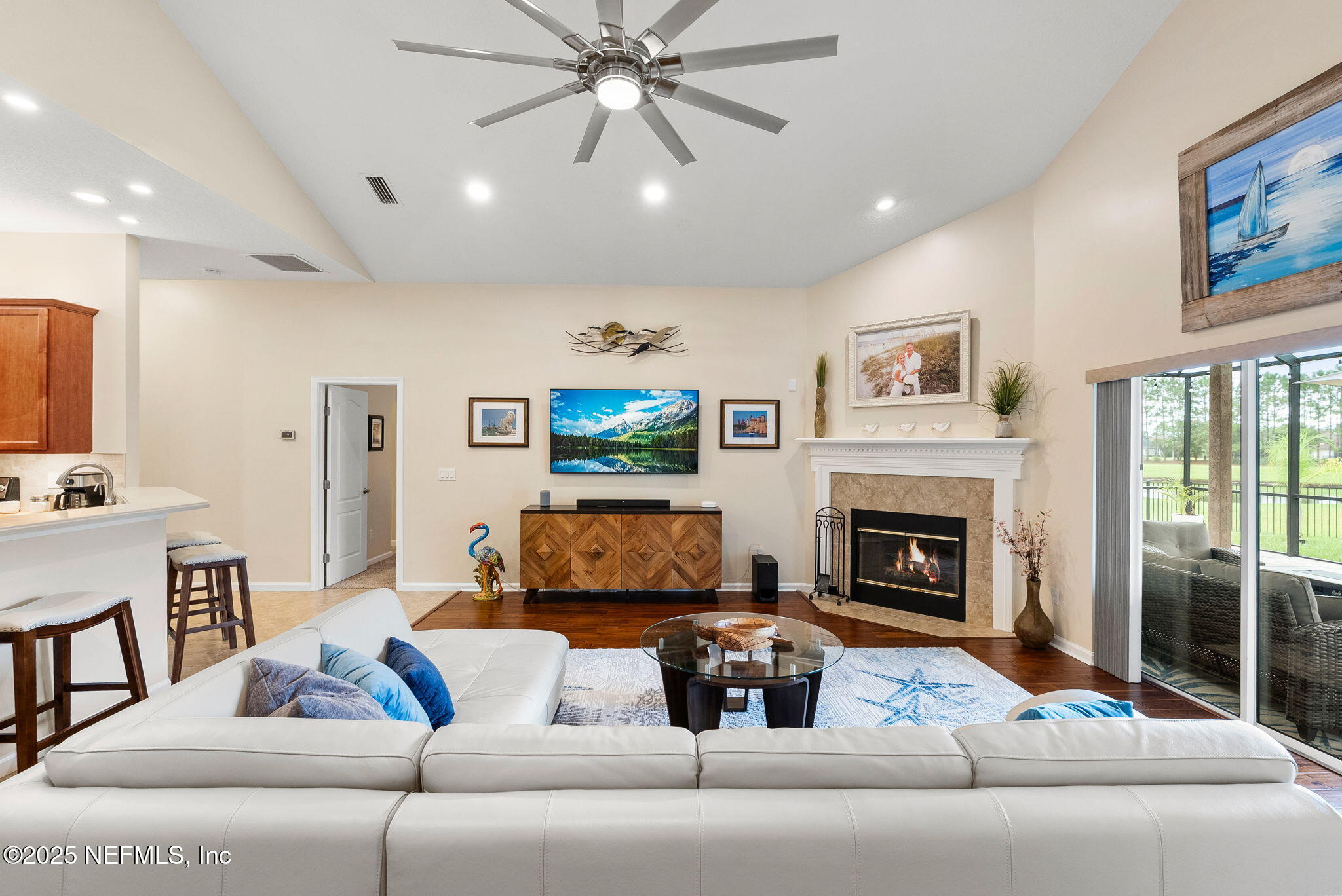 1428 Riva Del Garda Way St. Augustine, FL 32092 - Photo 16 of 44 a living room with furniture and a fireplace