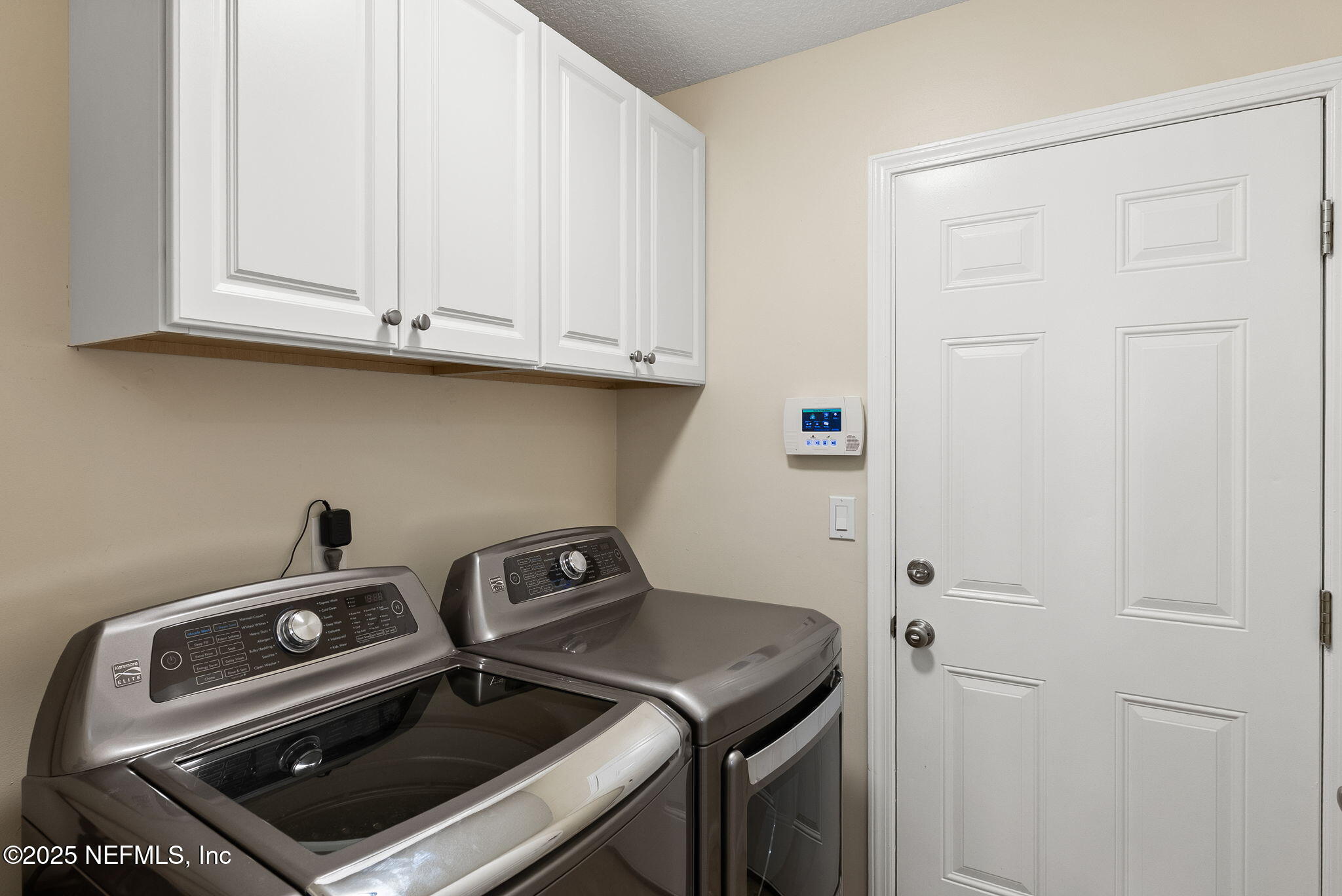1428 Riva Del Garda Way St. Augustine, FL 32092 - Photo 20 of 44 a utility room with dryer and washer