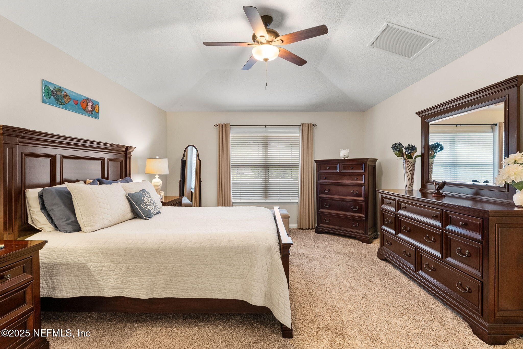 1428 Riva Del Garda Way St. Augustine, FL 32092 - Photo 21 of 44 a bedroom with a bed and a dresser