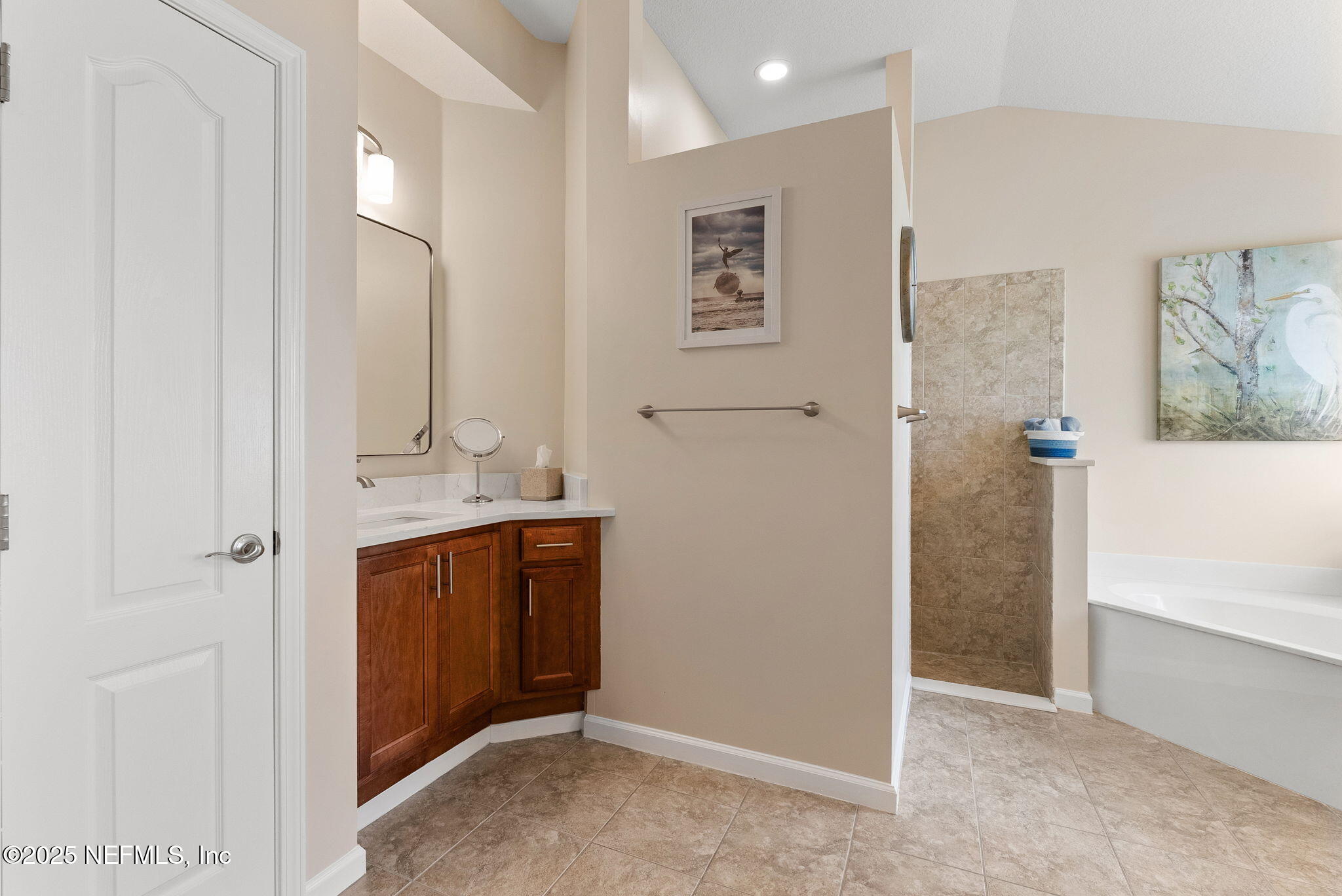 1428 Riva Del Garda Way St. Augustine, FL 32092 - Photo 24 of 44 a bathroom with a mirror sink and vanity