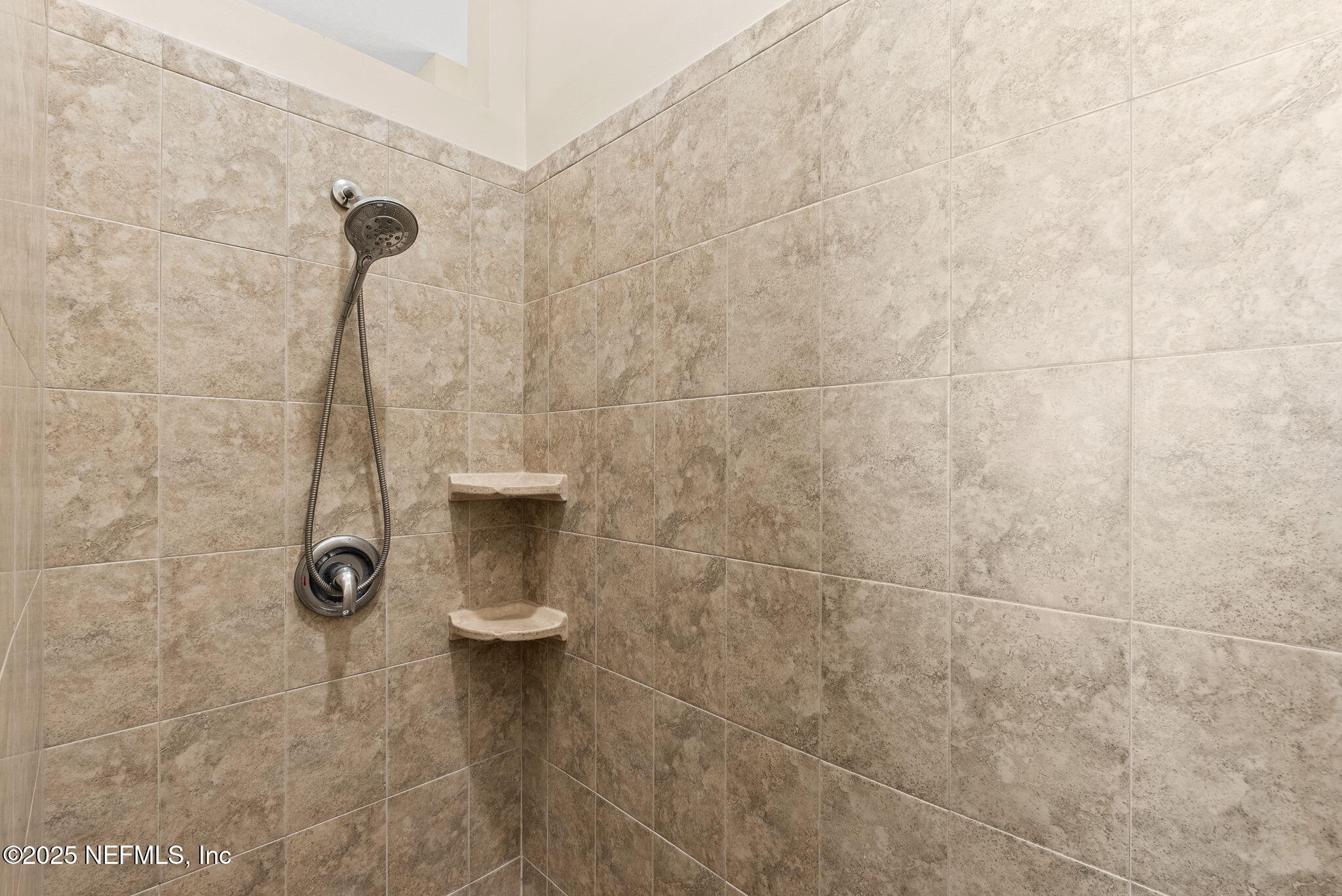 1428 Riva Del Garda Way St. Augustine, FL 32092 - Photo 26 of 44 a bathroom with a shower