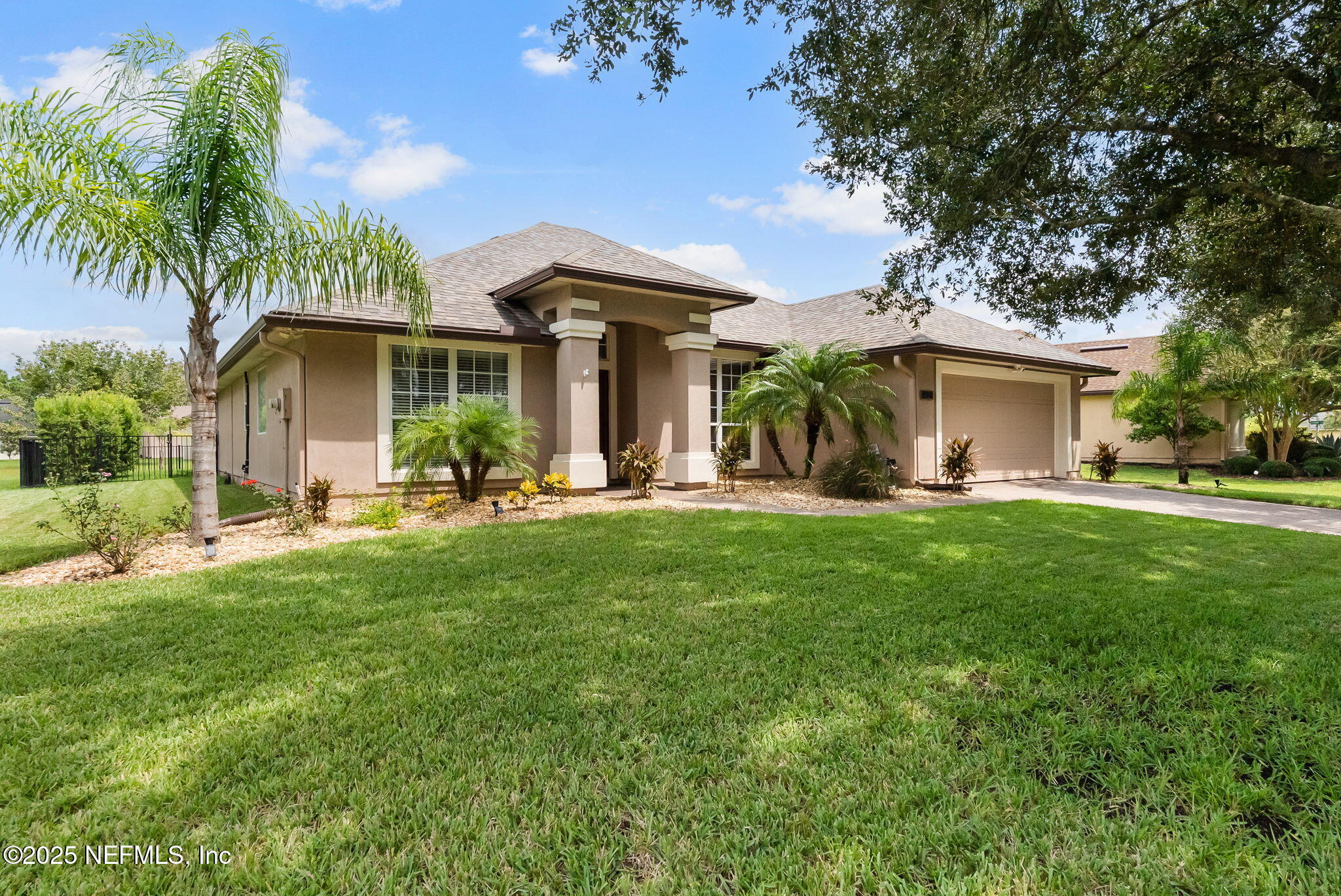 1428 Riva Del Garda Way St. Augustine, FL 32092 - Photo 3 of 44 a front view of house with yard and outdoor seating