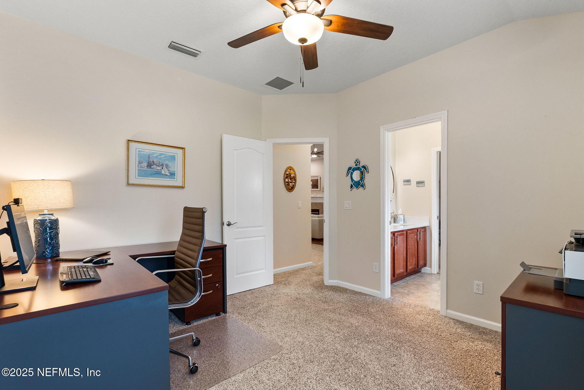 1428 Riva Del Garda Way St. Augustine, FL 32092 - Photo 34 of 44 a view of a workspace with furniture and a window