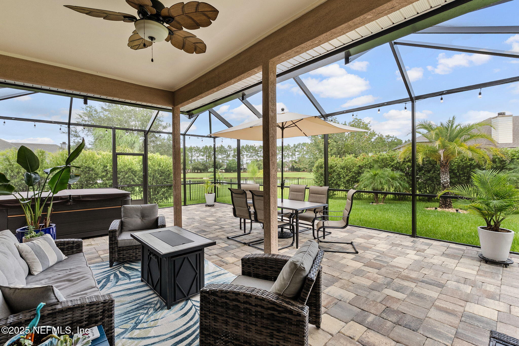 1428 Riva Del Garda Way St. Augustine, FL 32092 - Photo 35 of 44 a living room with furniture and a garden