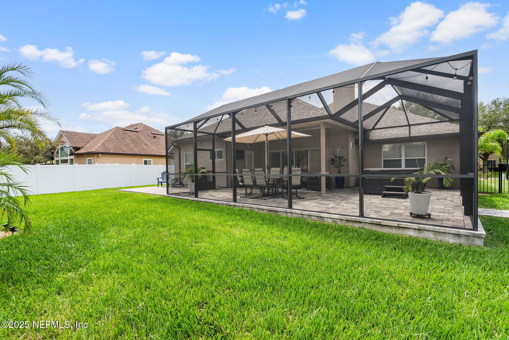 1428 Riva Del Garda Way St. Augustine, FL 32092 - Photo 41 of 44 a view of a house with a backyard porch and sitting area