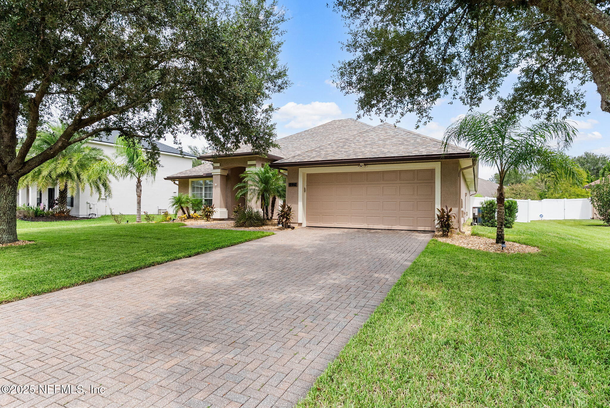 1428 Riva Del Garda Way St. Augustine, FL 32092 - Photo 43 of 44 a front view of house with yard and green space