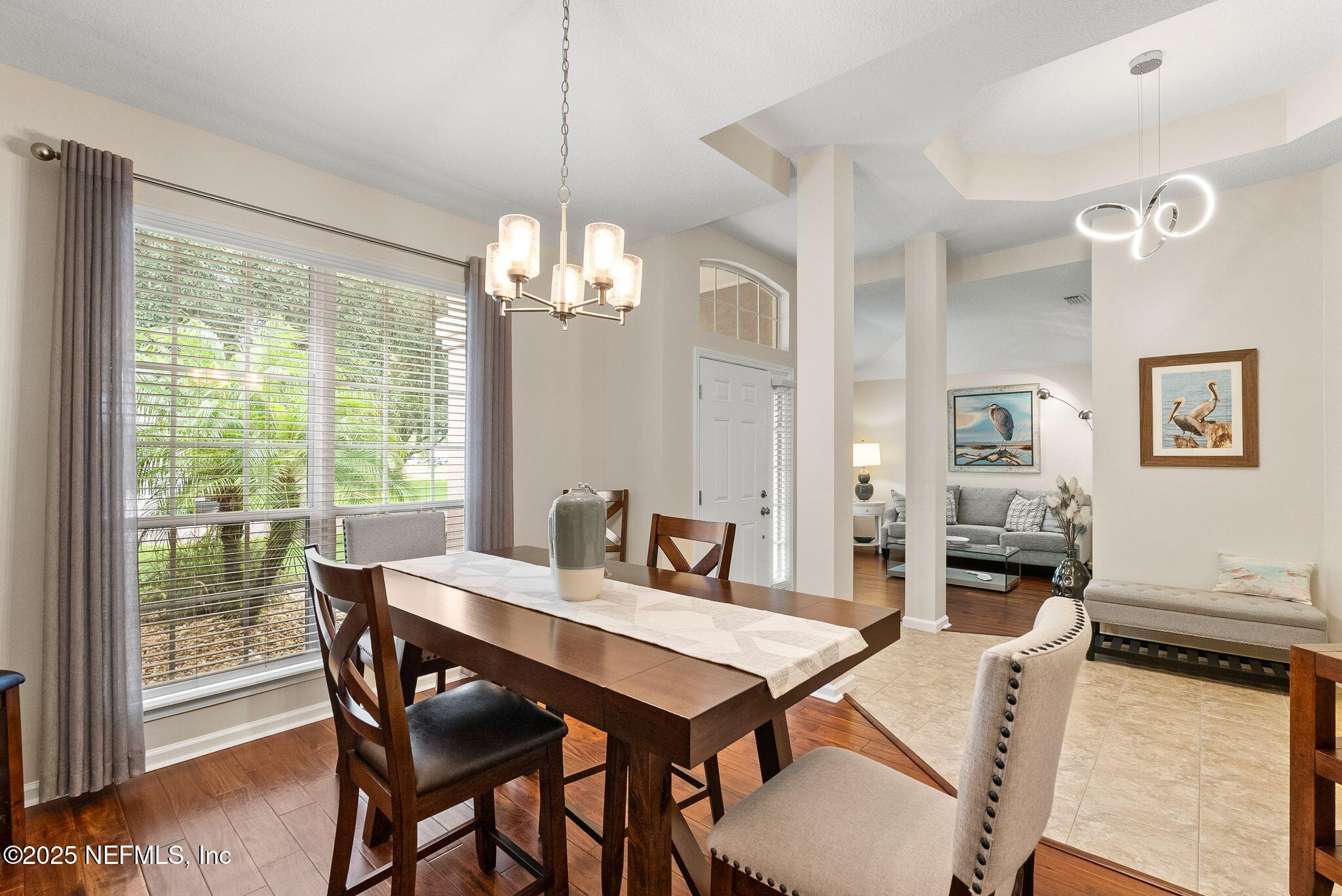1428 Riva Del Garda Way St. Augustine, FL 32092 - Photo 5 of 44 a view of a dining room with furniture window and wooden floor