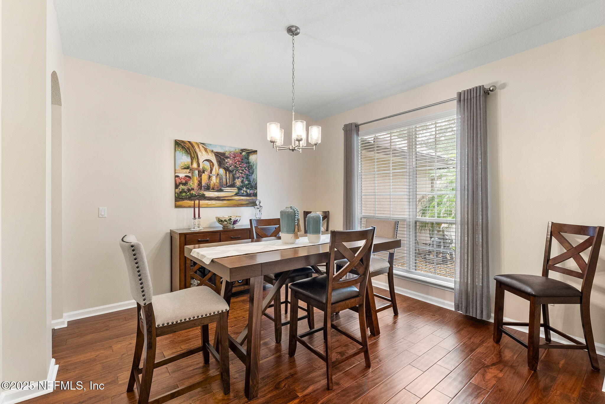 1428 Riva Del Garda Way St. Augustine, FL 32092 - Photo 6 of 44 a view of a dining room with furniture window and wooden floor