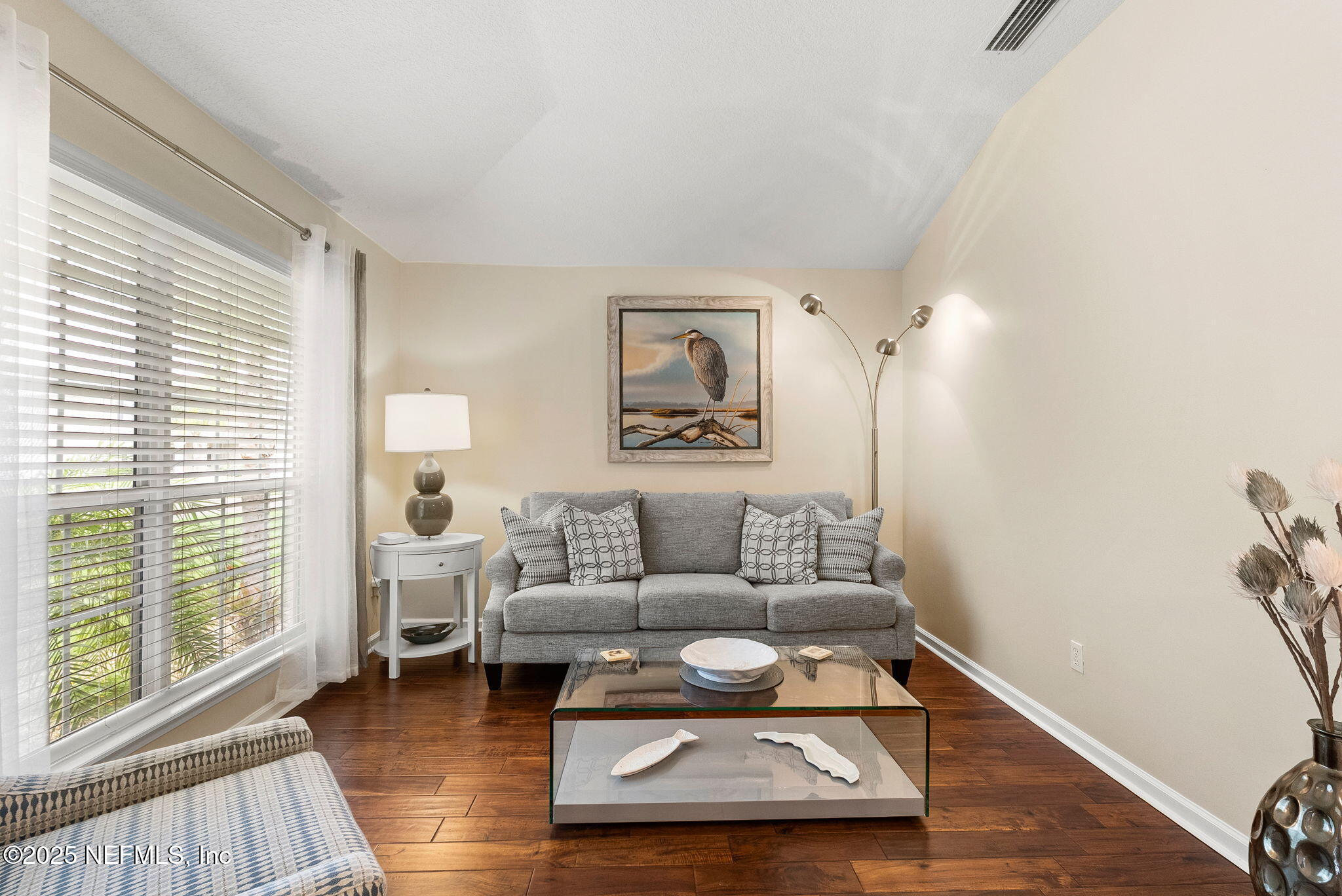 1428 Riva Del Garda Way St. Augustine, FL 32092 - Photo 9 of 44 a living room with furniture and a wooden floor