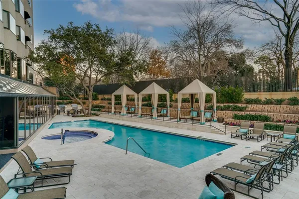 an aerial view of a house with swimming pool garden and patio