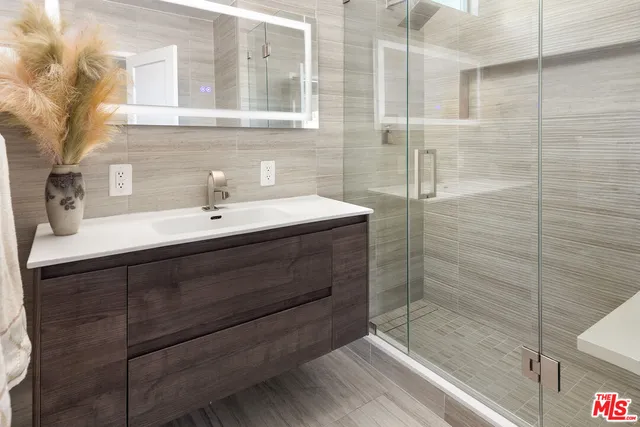 a bathroom with a sink and mirror