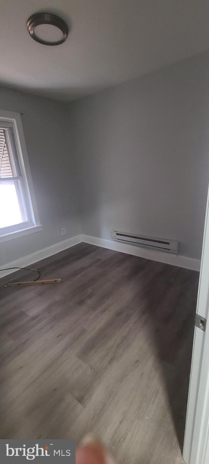 2026 Edgmont Avenue Chester, PA 19013 - Photo 8 of 11 a view of a room with wooden floor and more windows