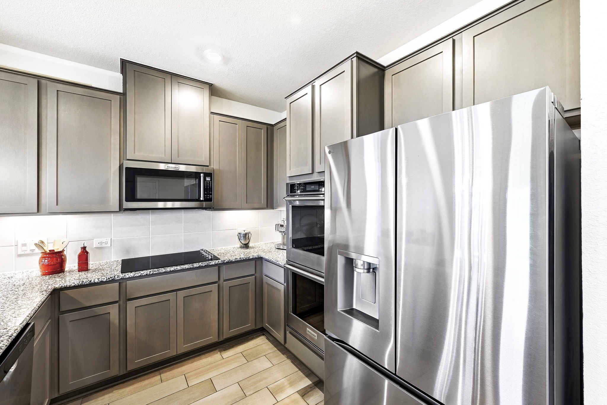 7201 Calliope Crossing Austin, TX 78744 - Photo 11 of 22 a kitchen with stainless steel appliances a refrigerator sink and microwave