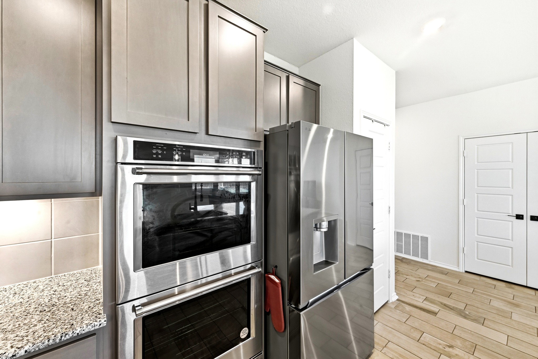 7201 Calliope Crossing Austin, TX 78744 - Photo 12 of 22 a kitchen with stainless steel appliances granite countertop a refrigerator and a stove
