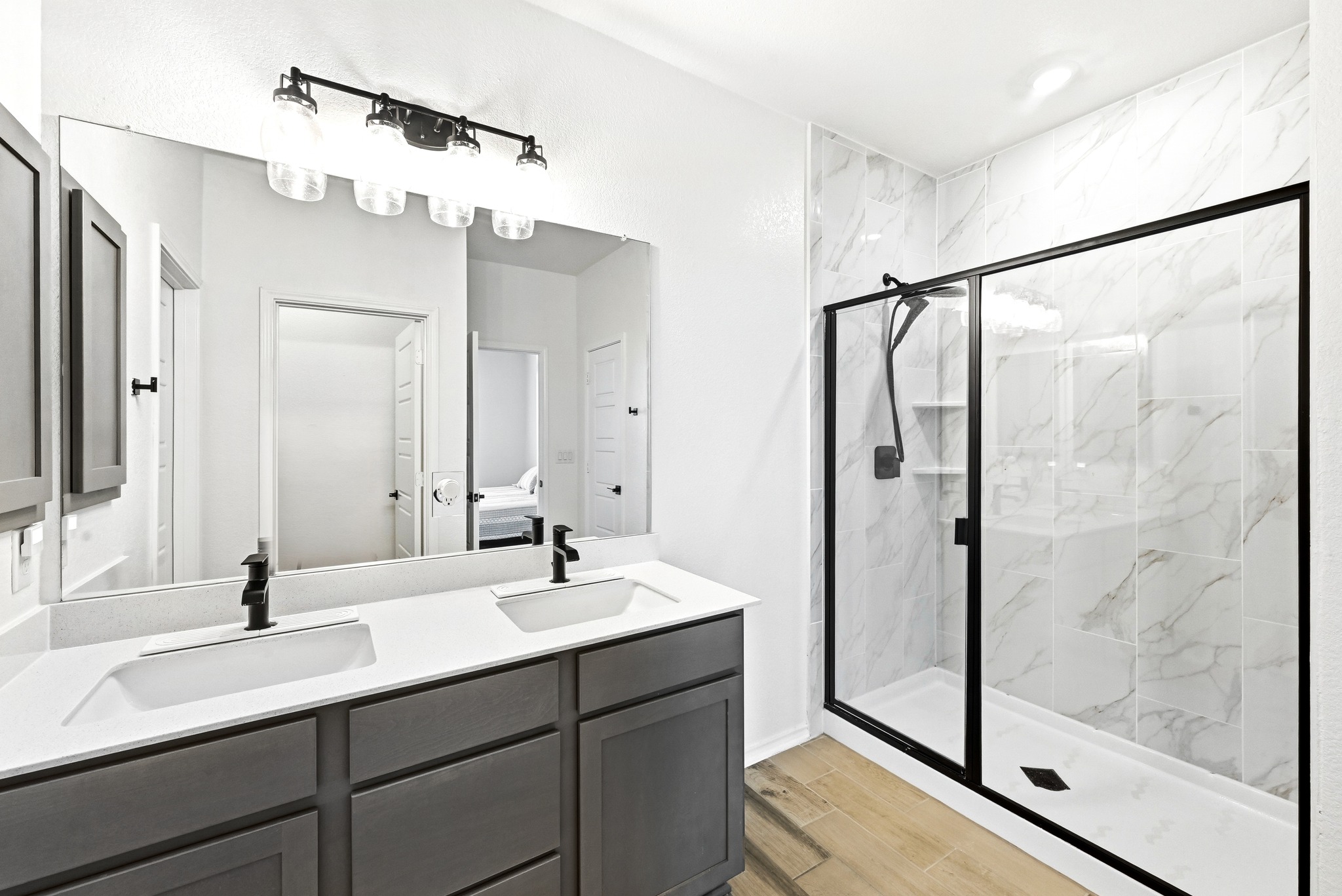 7201 Calliope Crossing Austin, TX 78744 - Photo 13 of 22 a bathroom with a double vanity sink mirror and shower