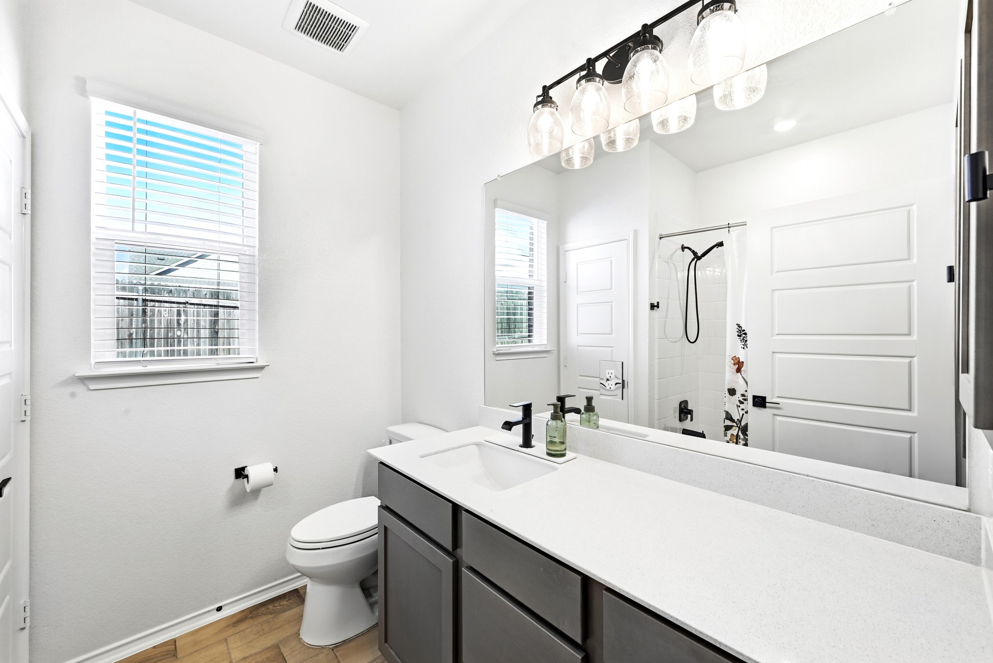7201 Calliope Crossing Austin, TX 78744 - Photo 14 of 22 a bathroom with a sink a toilet and shower