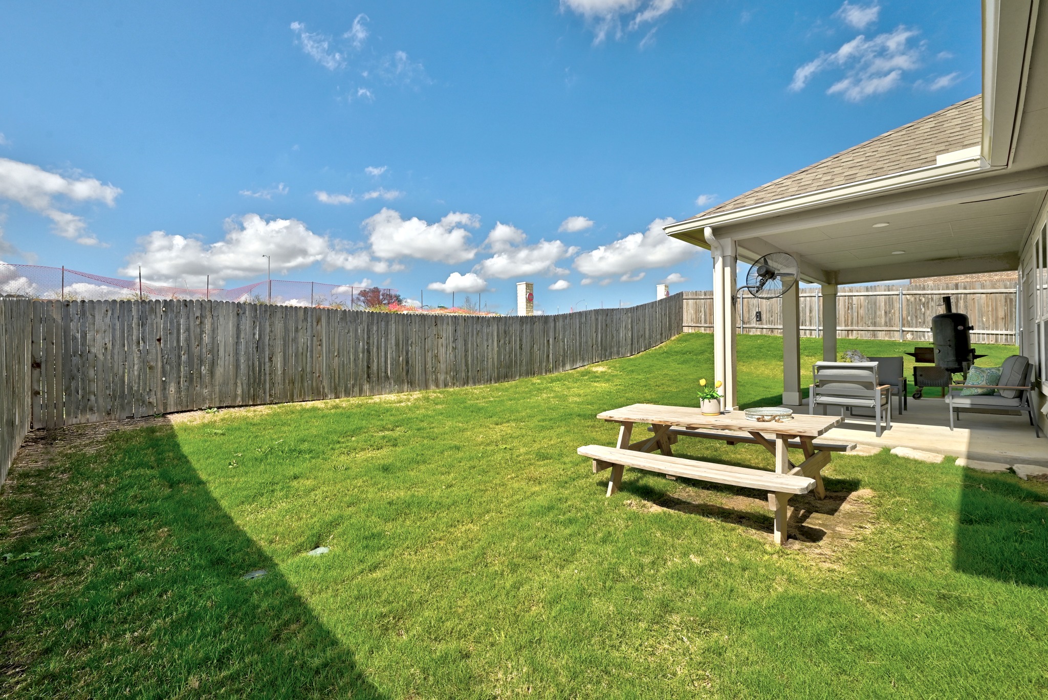 7201 Calliope Crossing Austin, TX 78744 - Photo 17 of 22 a view of backyard with table and chairs