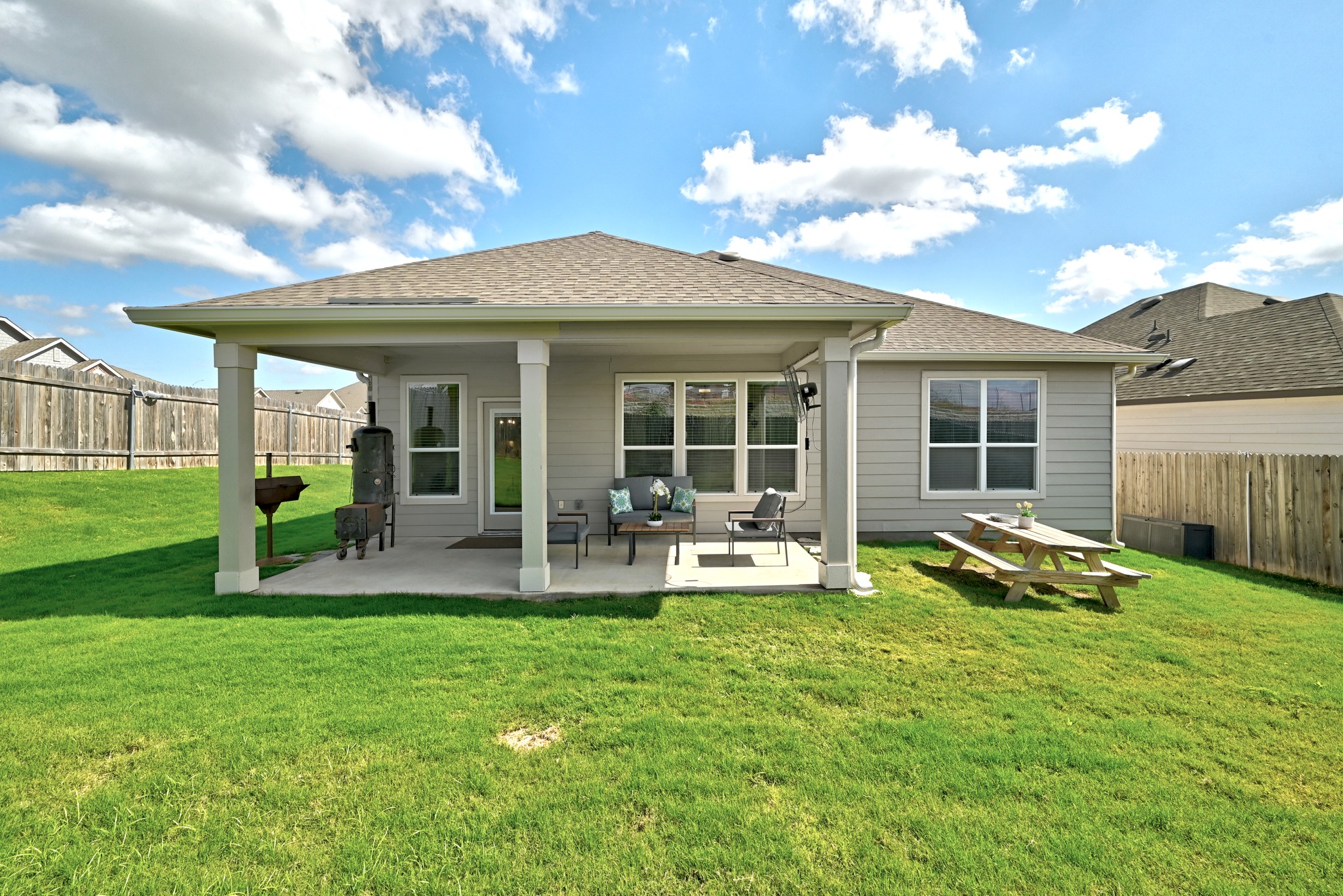 7201 Calliope Crossing Austin, TX 78744 - Photo 19 of 22 a view of a house with backyard porch and sitting area