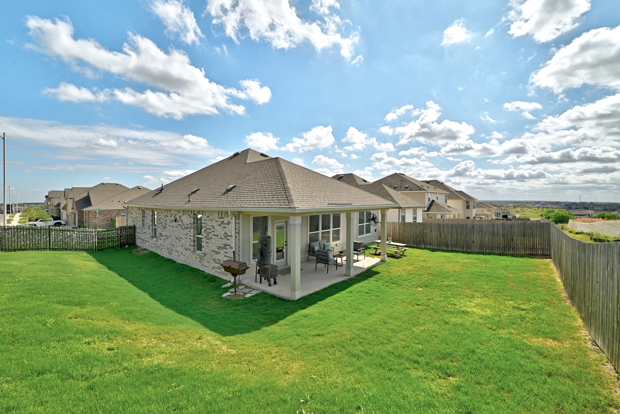 7201 Calliope Crossing Austin, TX 78744 - Photo 20 of 22 a front view of a house with garden