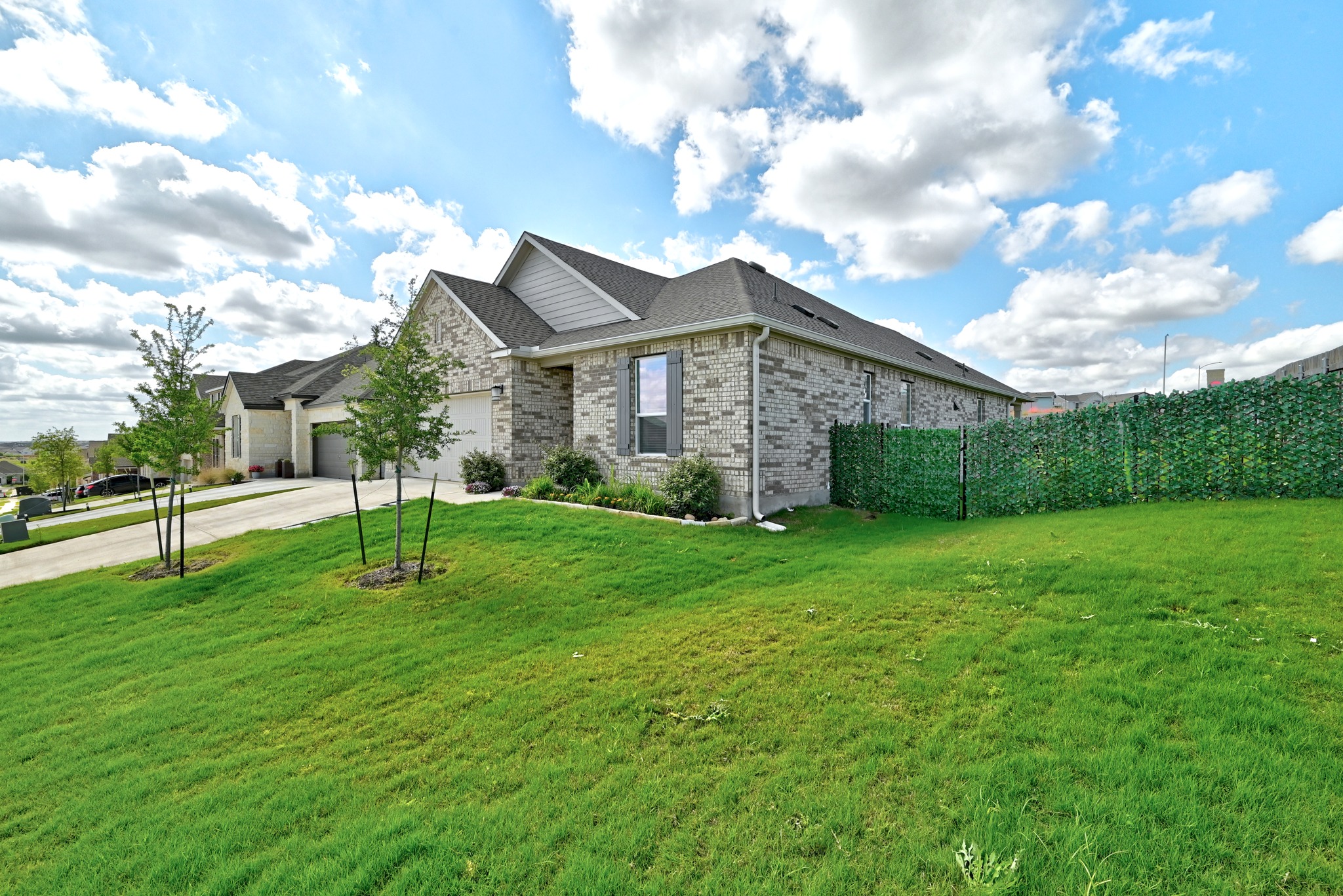 7201 Calliope Crossing Austin, TX 78744 - Photo 3 of 22 a view of a house with a backyard