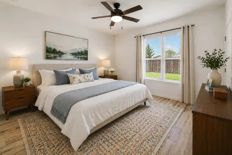 a bedroom with bed and window
