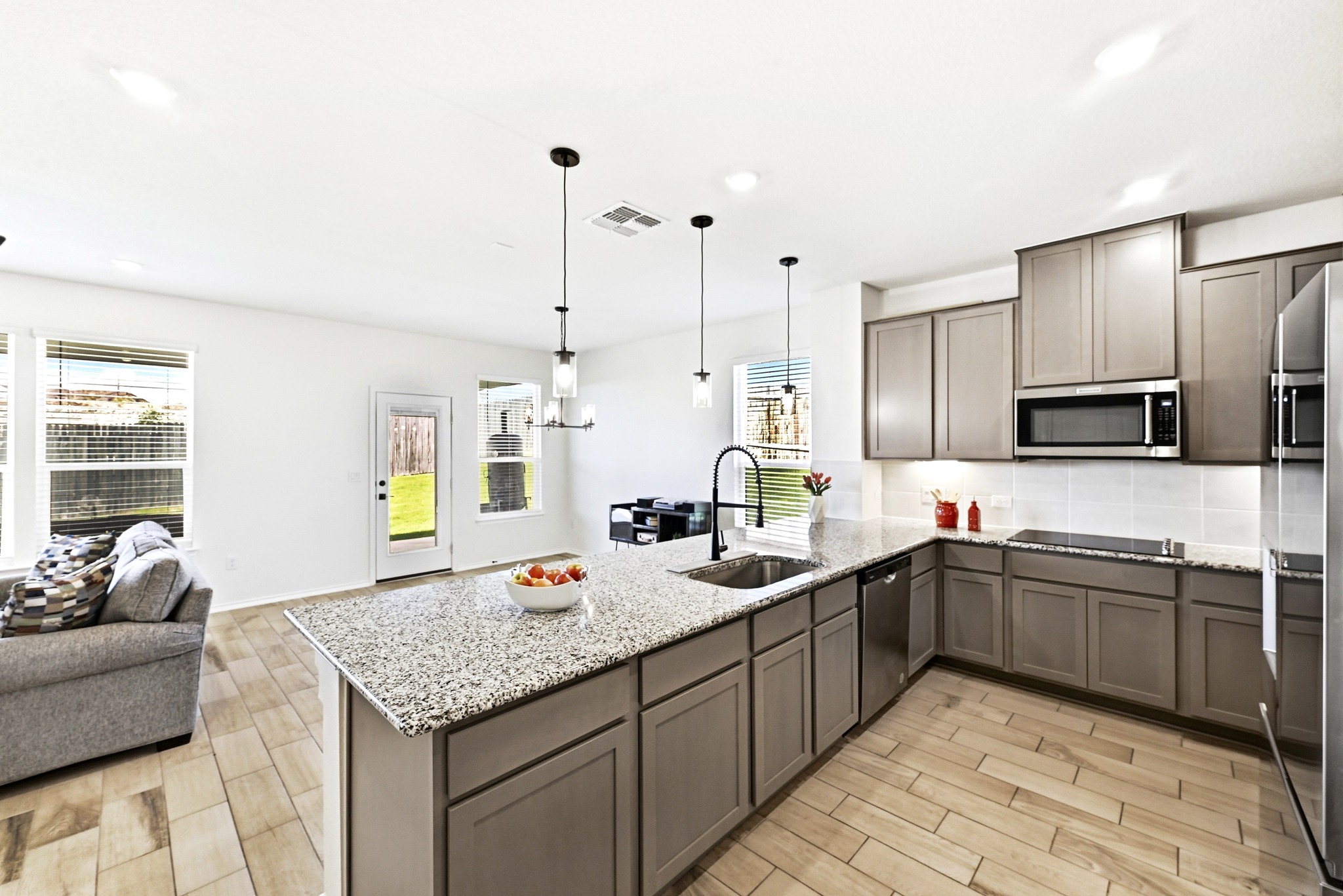 7201 Calliope Crossing Austin, TX 78744 - Photo 10 of 22 a kitchen with stainless steel appliances granite countertop a sink and stove